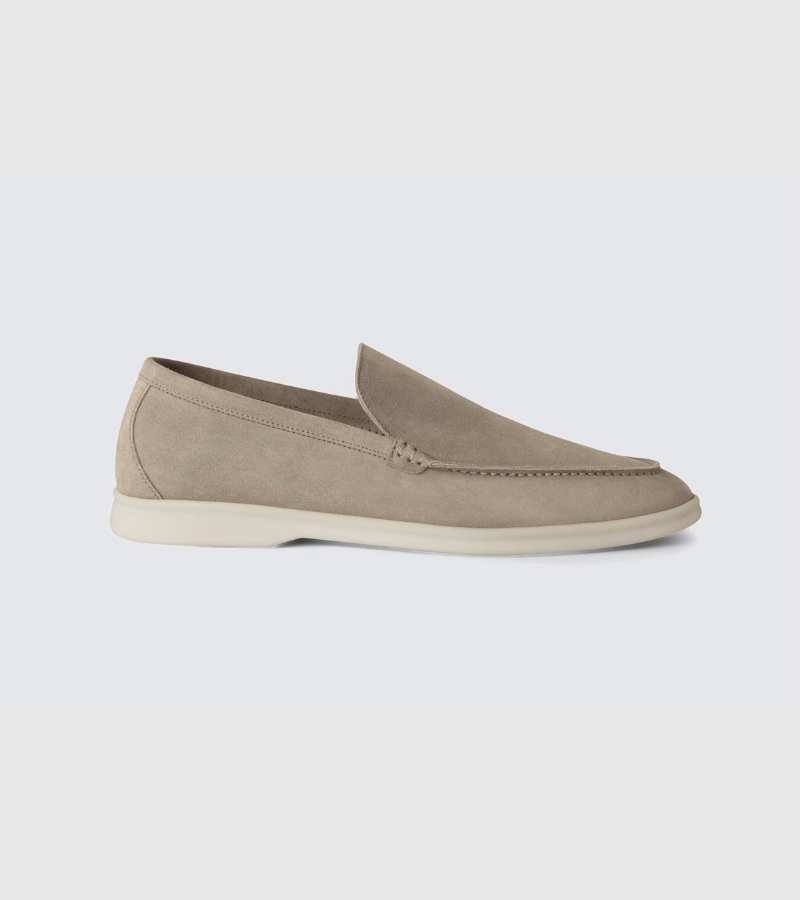 Beige loafer shoe on a light gray background